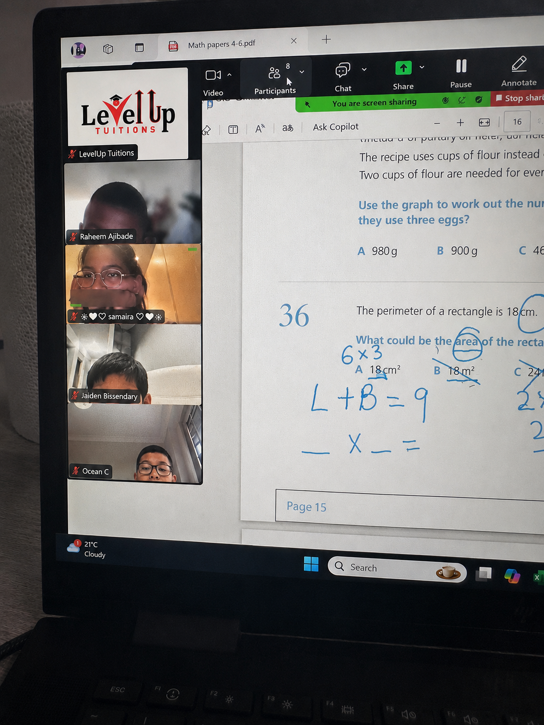 Online tuition lesson with shared screen and students